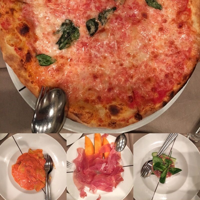 Paper Moonの料理。大きなマルゲリータと、生ハムメロンなどの前菜が並ぶ